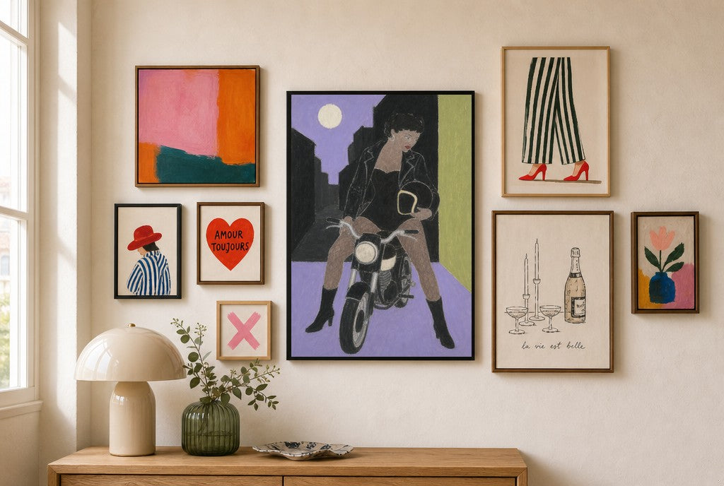 Motorcycle, Moonlit mixed into a layered gallery wall of varied frame sizes.
