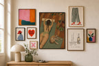 Reformer, Greyhound mixed into a layered gallery wall of varied frame sizes.