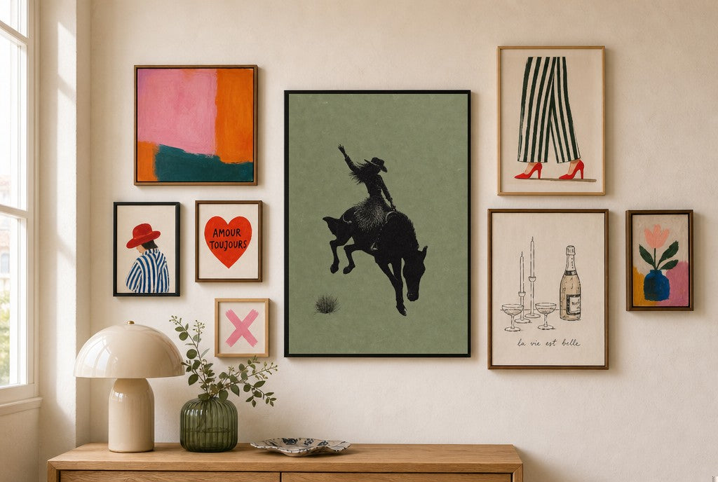Bronc Rider, Sage mixed into a layered gallery wall of varied frame sizes.