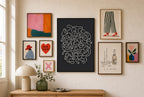 Tangled Cats mixed into a layered gallery wall of varied frame sizes.