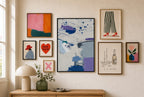 Cool Marks, Cream mixed into a layered gallery wall of varied frame sizes.