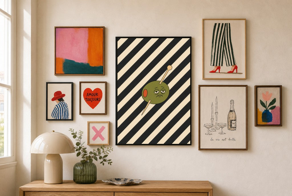 Olive on Stripes mixed into a layered gallery wall of varied frame sizes.