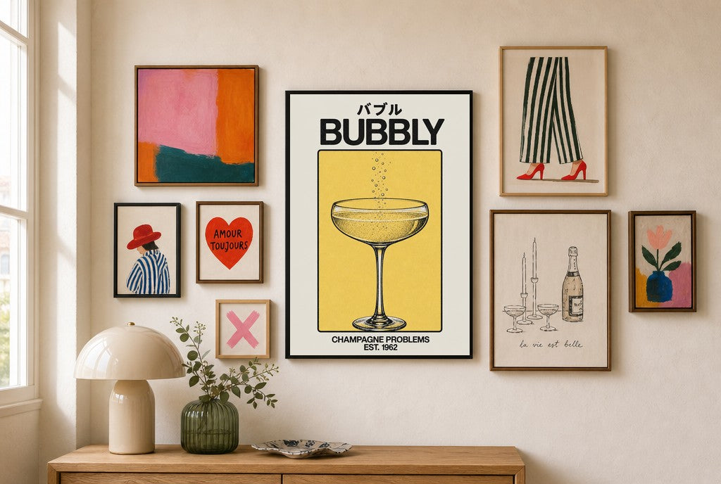 Champagne Problems mixed into a layered gallery wall of varied frame sizes.