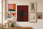 Greyhound, Black Beret mixed into a layered gallery wall of varied frame sizes.