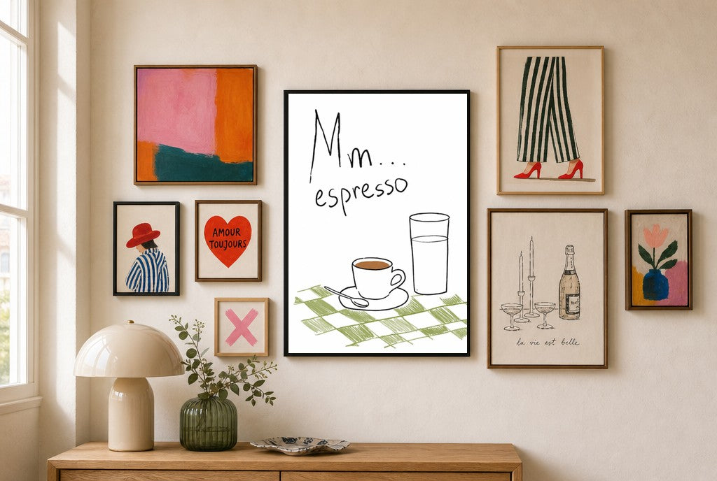 Mm Espresso mixed into a layered gallery wall of varied frame sizes.