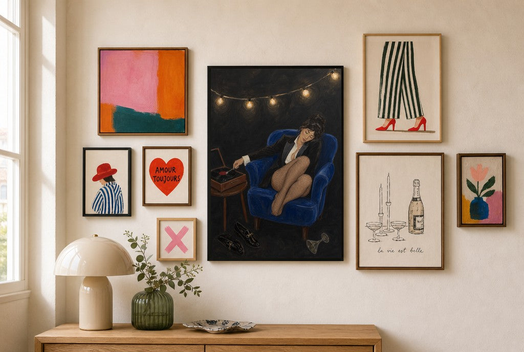 Tux, Vinyl, Cobalt mixed into a layered gallery wall of varied frame sizes.