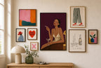 Slip Dress, Plum mixed into a layered gallery wall of varied frame sizes.