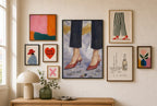 Red Heels, Ash mixed into a layered gallery wall of varied frame sizes.