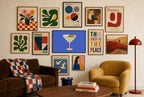 Angry Olive, Martini mixed into a layered gallery wall of varied frame sizes.