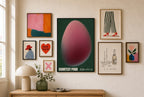 Courtesy Pour, Capsule mixed into a layered gallery wall of varied frame sizes.
