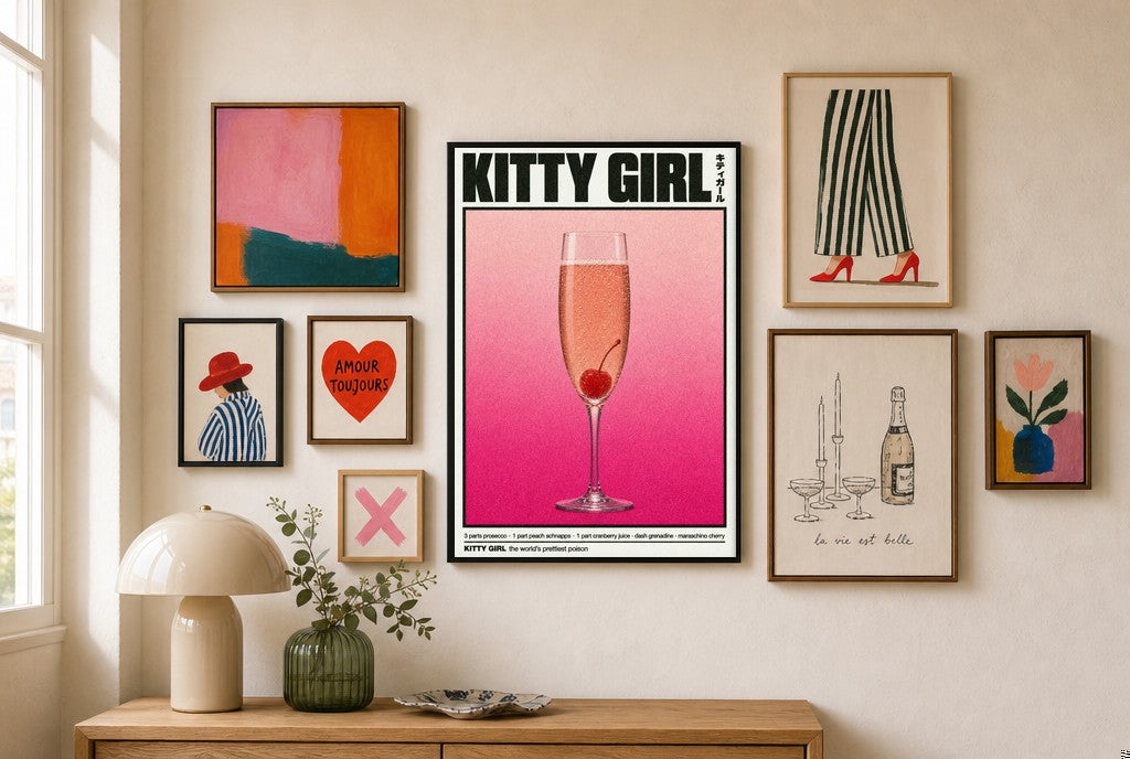 Kitty Girl mixed into a layered gallery wall of varied frame sizes.