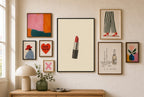 One Lipstick, Cream mixed into a layered gallery wall of varied frame sizes.