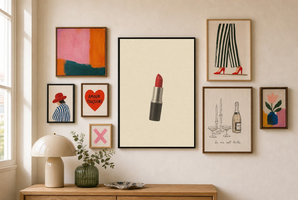 One Lipstick, Cream mixed into a layered gallery wall of varied frame sizes.