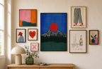 Red Sun, Charcoal Range mixed into a layered gallery wall of varied frame sizes.
