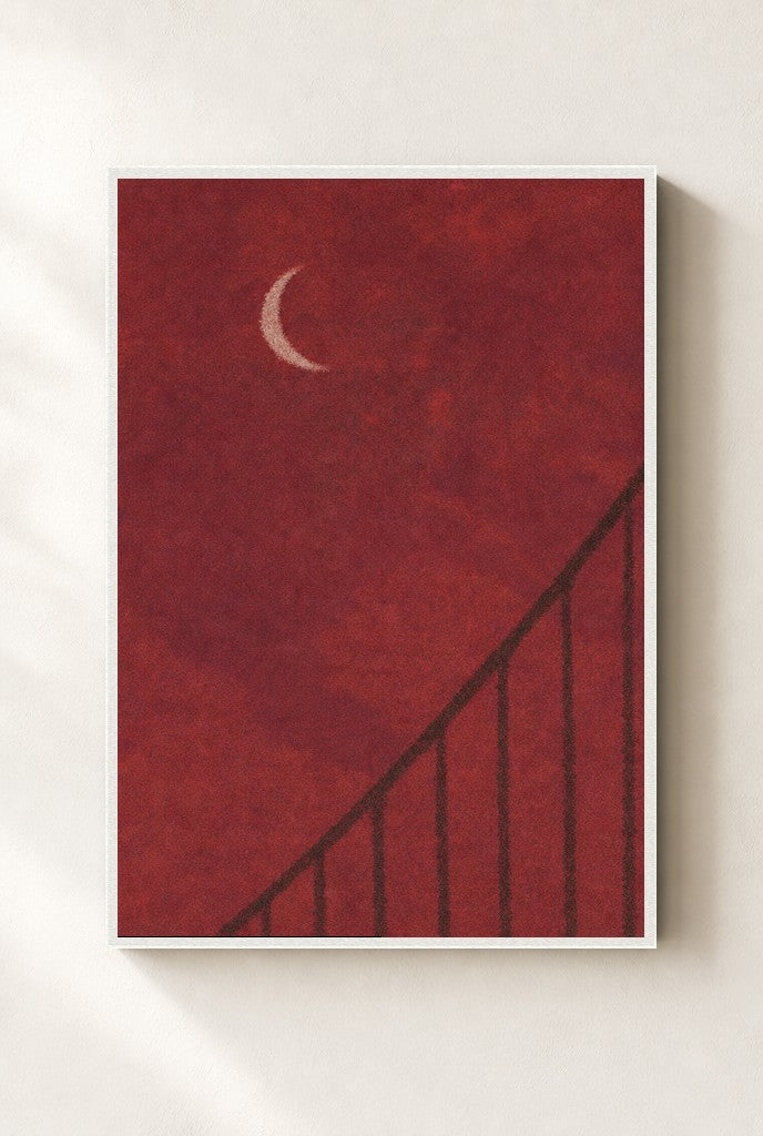 Oxblood Sky, Crescent print, mounted in a white wood frame on a cream wall.