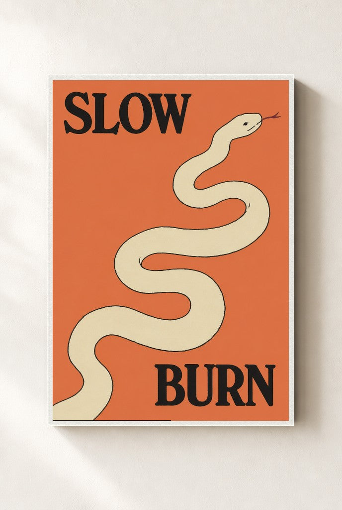 Slow Burn print, mounted in a white wood frame on a cream wall.