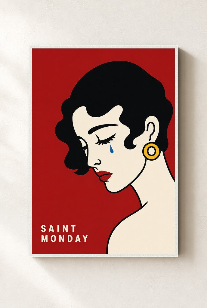 Saint Monday print, mounted in a white wood frame on a cream wall.