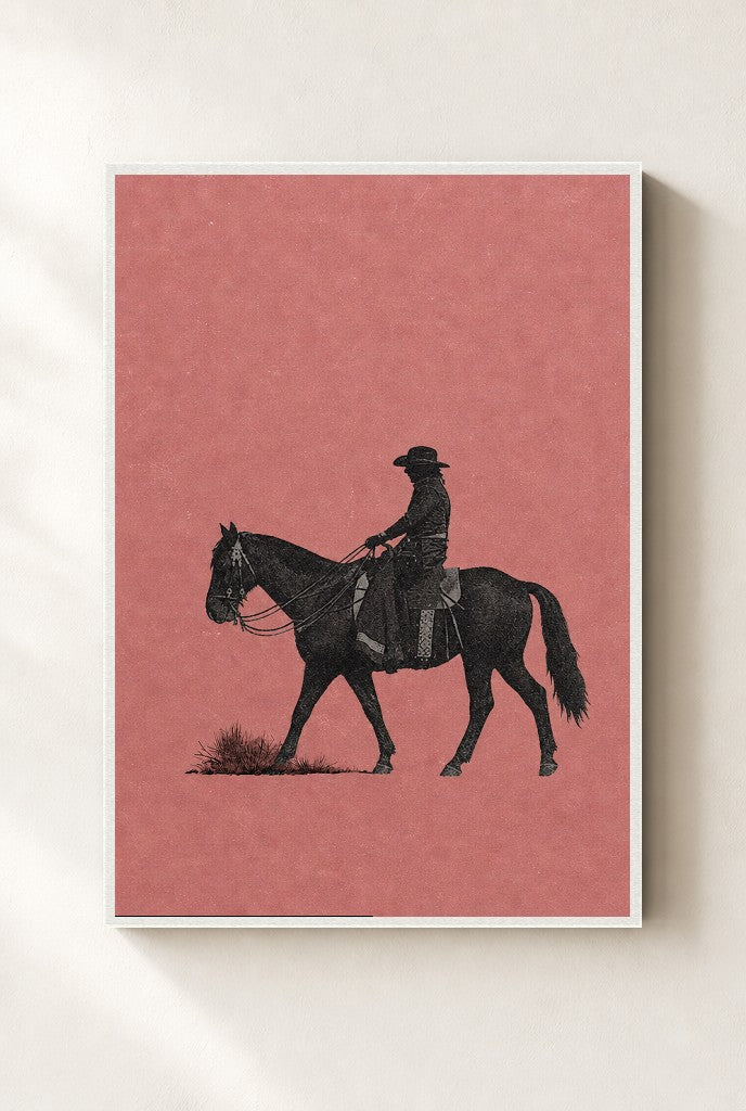 Cowgirl, Dusty Pink print, mounted in a white wood frame on a cream wall.