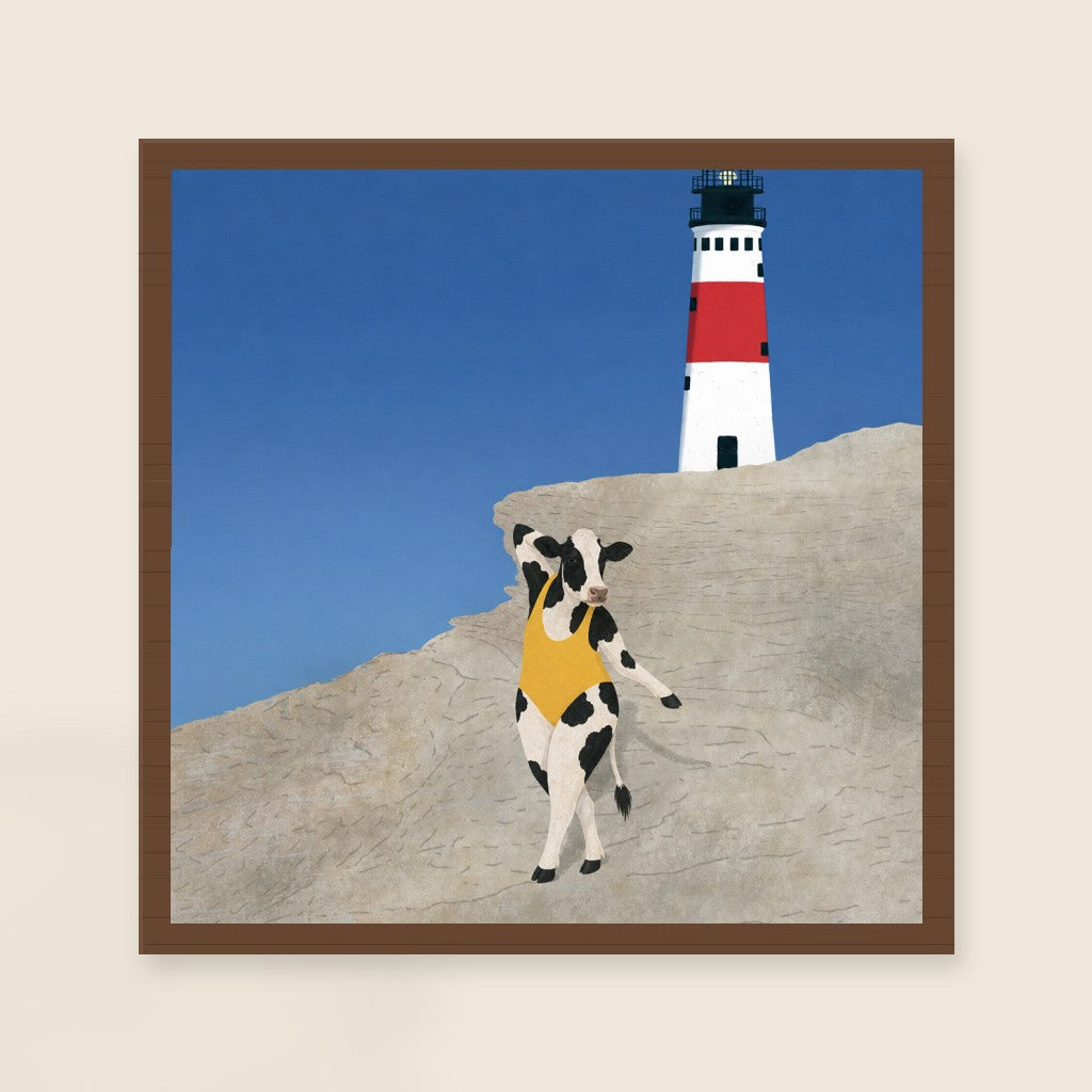 Yellow at the Lighthouse print, mounted in a walnut wood frame on a cream wall.