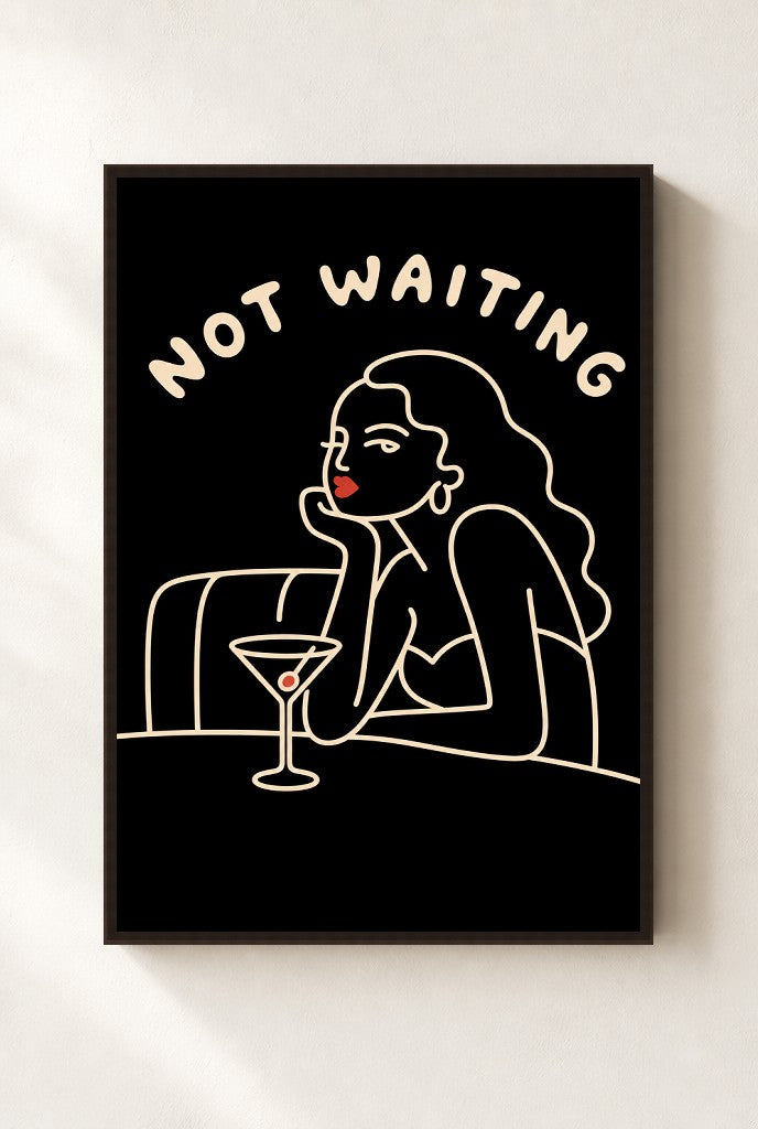 Not Waiting print, mounted in a walnut wood frame on a cream wall.