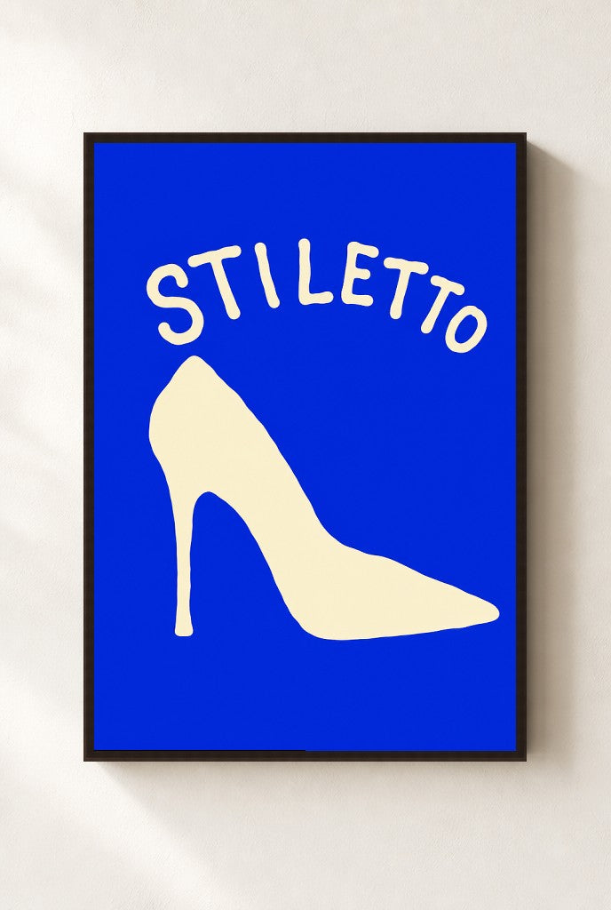 Stiletto print, mounted in a walnut wood frame on a cream wall.