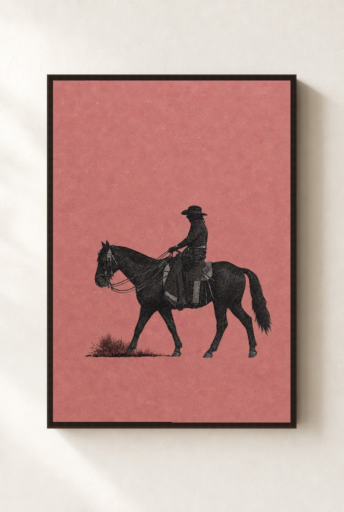 Cowgirl, Dusty Pink print, mounted in a walnut wood frame on a cream wall.