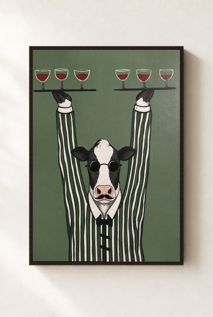 Pour Cow print, mounted in a walnut wood frame on a cream wall.