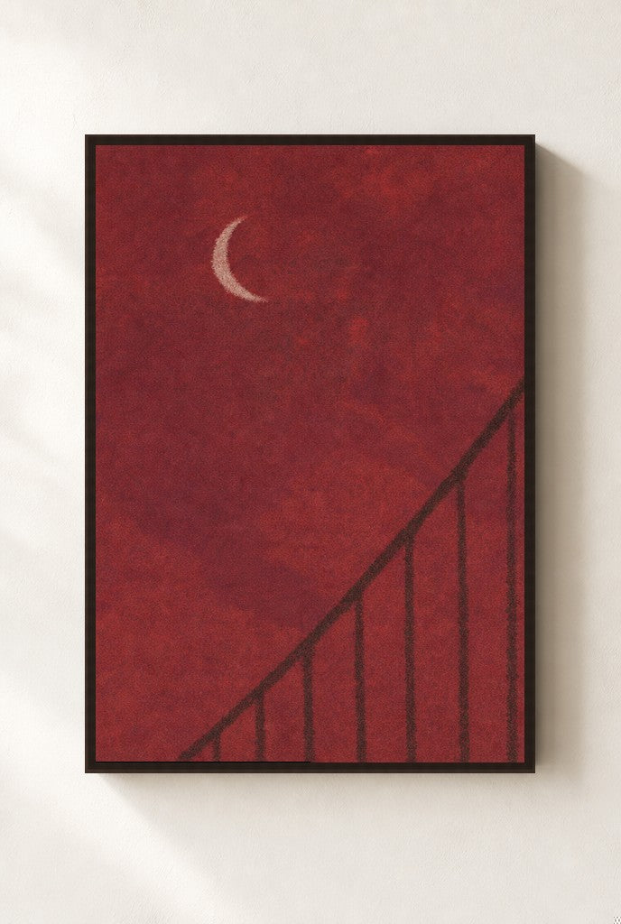 Oxblood Sky, Crescent print, mounted in a walnut wood frame on a cream wall.
