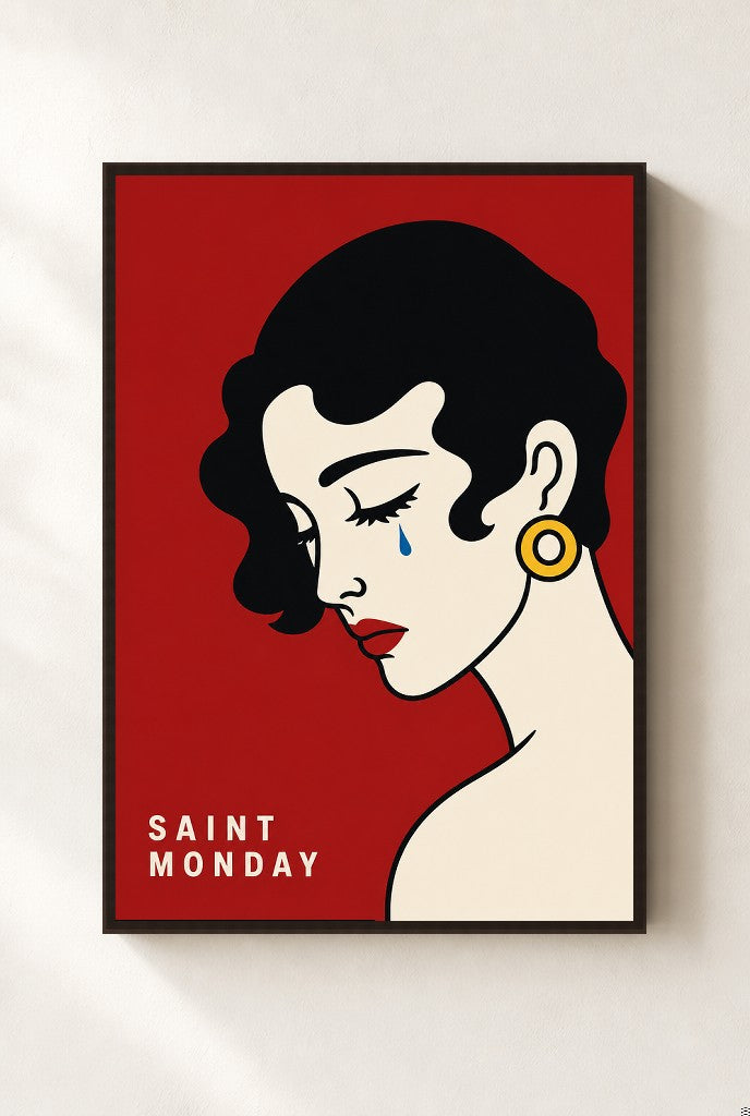 Saint Monday print, mounted in a walnut wood frame on a cream wall.