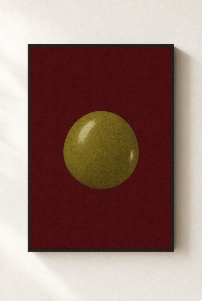 One Olive, Oxblood print, mounted in a walnut wood frame on a cream wall.